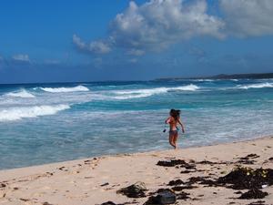 Running headfirst into the waves at surfer’s beach. - Eleuthera, Bahamas - A tiny chain of islands photo copyright Clarity Nicoll taken at  and featuring the  class