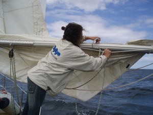 Donna Lange - taking a reef aboard Inspired Insanity © Angie Deister