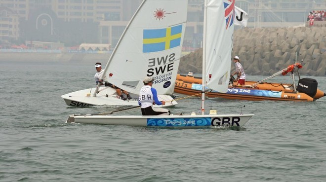 Paul Goodison rounds the first mark ahead of Rasmus Myrgren (SWE) after Goodison match raced his nearest rival off the Medal race course in the Mens Laser class 2008 Olympics © Richard Gladwell www.photosport.co.nz