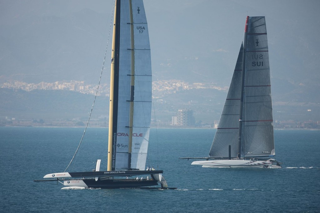 BMW Oracle with Alinghi in the background off Valencia photo copyright BMW Oracle Racing Photo Gilles Martin-Raget www.bmworacleracing.com taken at  and featuring the  class