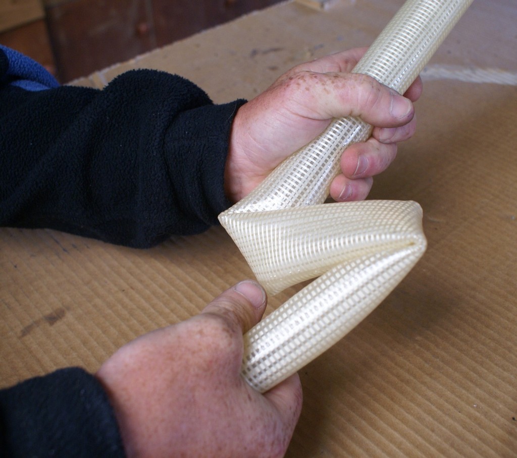Alex Vallings demonstrates the extreme flexibility of the C-Tech Air Batten product. It returned to a perfectly straight, no kinks tube immediately. photo copyright Richard Gladwell www.photosport.co.nz taken at  and featuring the  class