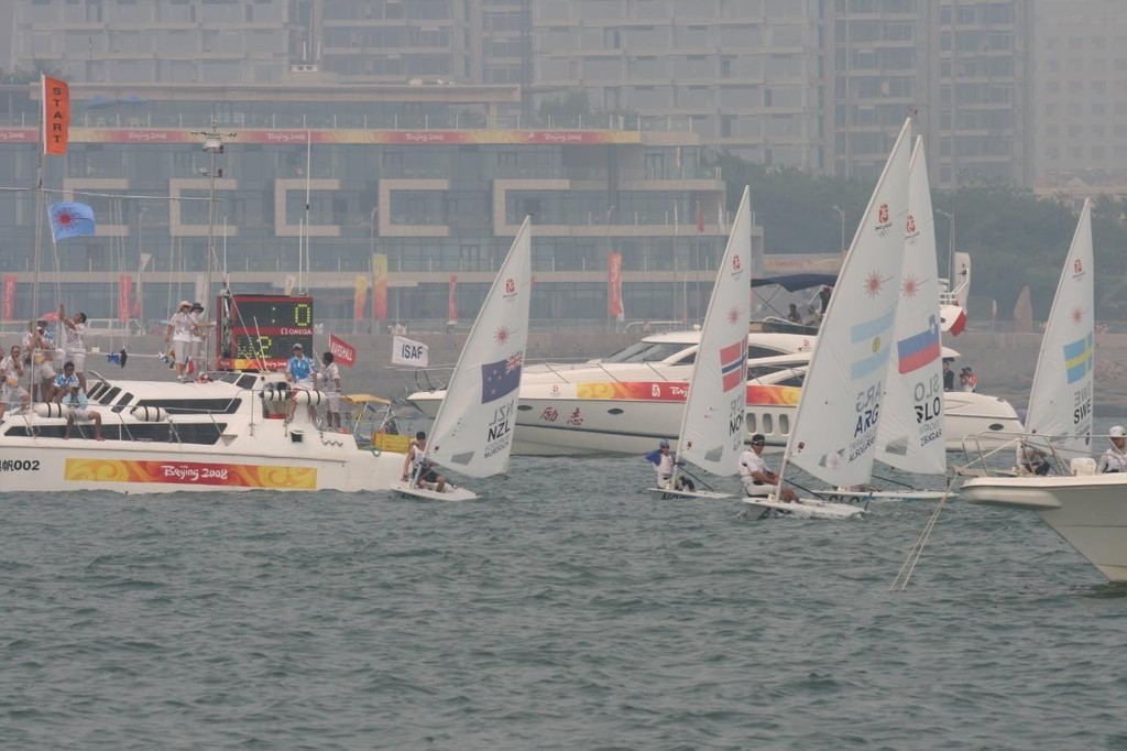 Andrew Murdoch (NZL) lines up a start under the committee boat - 2008 Olympics Qingdao - Medal Race - Laser © Richard Gladwell www.photosport.co.nz