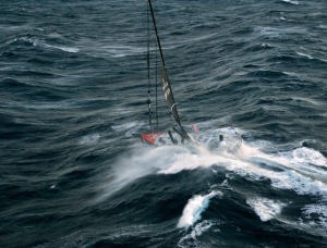 Alex Thompson runs for a safe port in the Velux 5 Oceans race photo copyright onEdition http://www.onEdition.com taken at  and featuring the  class