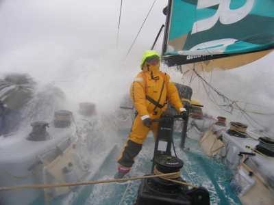 Crewman grinding as waves wash over the decks on Volvo Open 70 ABN AMRO ONE Leg 4  © Volvo Ocean Race http://www.volvooceanrace.com