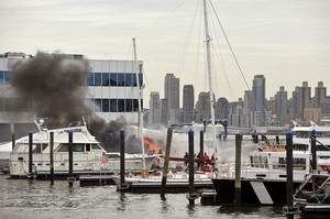 North Hudson Regional firefighters battle a blaze on two boats at the Lincoln Harbor marina in Weehawken, Tuesday, December 9, 2008. -- REENA ROSE SIBAYAN / THE JERSEY JOURNAL photo copyright SW taken at  and featuring the  class