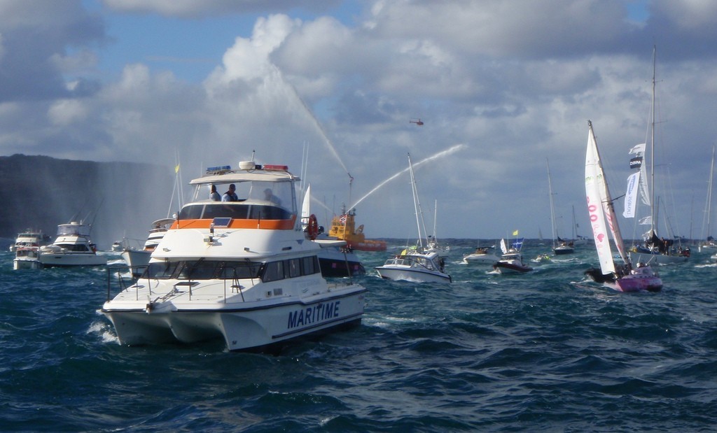Jessica Watson crosses the finish line between Sydney's North and South Heads photo copyright NSW Maritime http://www.maritime.nsw.gov.au taken at  and featuring the  class