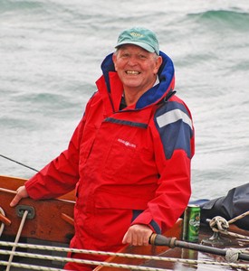 In his element - Bob Fisher, a smile on his face, a tiller in his hand and a cold beer waiting at his side. photo copyright SW taken at  and featuring the  class