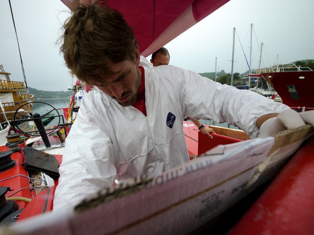 Mike Pammenter doing last minute repairs onboard Camper in Puerto Montt, during Leg 5 of the Volvo Ocean Race 2011-12, from Auckland, New Zealand to Itajai, Brazil.  © Hamish Hooper/Camper ETNZ/Volvo Ocean Race