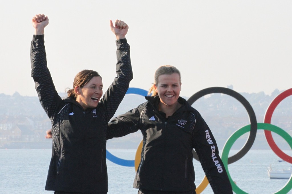  August 10, 2012 - Weymouth, England - Jo Aleh and Olivia Powrie step up on the podium before being presneted with their Olympic Gold Medal for the Womens 470 © Richard Gladwell www.photosport.co.nz