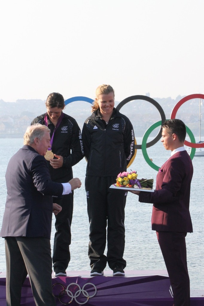  August 10, 2012 - Weymouth, England - Jo Aleh and Olivia Powrie about to be presented with their Gold Medal by Goran Pettersen President of the International Sailing Federation and IOC Member © Richard Gladwell www.photosport.co.nz