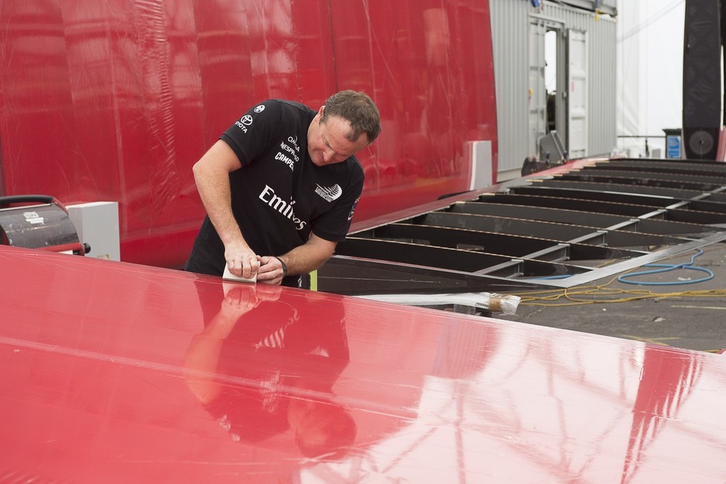 Emirates Team New Zealand, Glen Ashby works on fitting Mizar skin on to one of the flaps of Wing one. 23/1/2013 © Chris Cameron/ETNZ http://www.chriscameron.co.nz