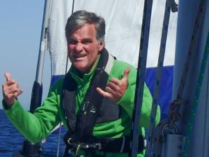 This non-verbal communication is a little confusing, happy hands…angry face. “Do you want that genoa sheet eased or hardened, or do you want me to get you a bucket and call a doctor?” photo copyright Ken Gillstrom taken at  and featuring the  class