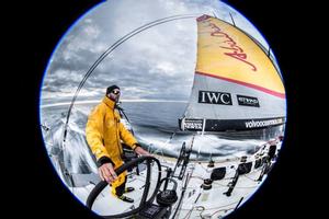 Leg 7 to Lisbon onboard Abu Dhabi Ocean Racing. Day 3. 8mm circular fisheye shot of Ian Walker driving at sunset in the Atlantic Ocean. - Volvo Ocean Race 2015 photo copyright Matt Knighton/Abu Dhabi Ocean Racing taken at  and featuring the  class