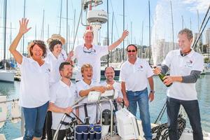 Mikkel Anthonisen Founder of the Oceans of Hope Project pops celebratory champagne with the crew photo copyright Anna Kucera taken at  and featuring the  class