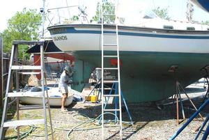 Will_Barbeau_Photo by Will Barbeau   Donna Lange sanding her boat to prepare for trip photo copyright Will Barbeau taken at  and featuring the  class