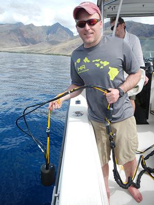 WHOI scientist Aran Mooney readies the accelerometer for deployment off the coast of Maui. photo copyright Max Kaplan, WHOI taken at  and featuring the  class