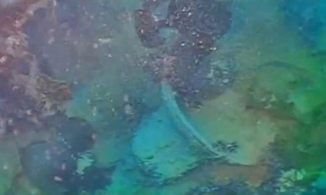 The bell of HMS Terror on the deck of the sunken vessel. © Arctic Research Foundation