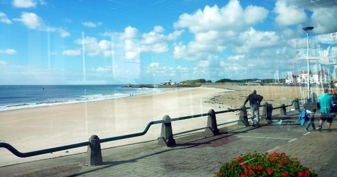 Vlissingen beach seen from the warmth of the glass solar train © SV Taipan