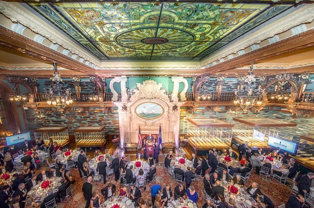 The America’s Cup Hall of Fame induction was held at the New York Yacht Club’s magnificent Model Room. Measuring forty-five feet wide and ninety-six feet deep, the Model Room holds most of the Club’s collection of approximately 1,300 models—including fully-rigged models of Cup challengers and defenders. The galleon-style bay windows and the carvings of dolphins, shells, and clouds punctuated with lightning bolts, create the impression, as one visitor observed, that “except for the absence of motion, one might fancy oneself at sea.” - Hall of Fame induction for Ernesto Bertarelli Alinghi and Lord Dunraven - photo © Carlo Borlenghi http://www.carloborlenghi.com