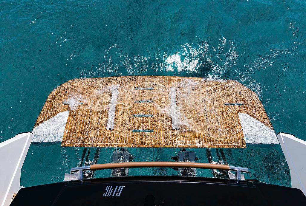 Hydraulic swim platform of the GT46 down. Photo Credit: Nicolas Claris photo copyright Beneteau http://www.beneteau.com/ taken at  and featuring the  class