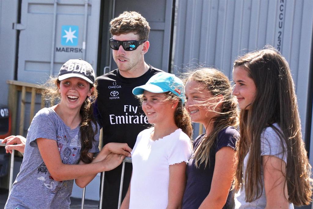 Emirates Team New Zealand's  helmsman Peter Burlings poses with fans at the fence of the team's base in Bermuda - photo © Richard Gladwell www.photosport.co.nz