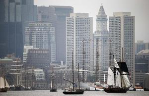 Tall ships pass in front of the skyline during Sail Boston's Parade of Sail on Saturday photo copyright  Michael Dwyer / AP taken at  and featuring the  class