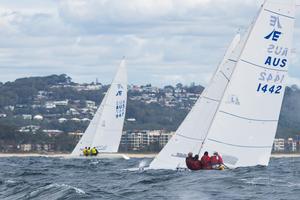 The yellow jerseys of Magpie in against the beach, with Iron Lotus in behind one of the many waves on offer today. - 2017 Etchells Australasian Championship photo copyright  Alex McKinnon Photography http://www.alexmckinnonphotography.com taken at  and featuring the  class