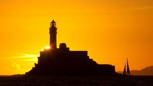 Rounding the historic Fastnet Rock - a lasting memory for all crews in the Rolex Fastnet Race starting from the Royal Yacht Squadron on Sunday 6th August photo copyright  Rolex/Daniel Forster http://www.regattanews.com taken at  and featuring the  class