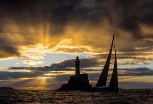 A spectacular sunrise as the 115ft superyacht Nikata rounded the Fastnet Rock at 06:41:05 on Tuesday morning - Rolex Fastnet Race 2017 photo copyright  Rolex/ Kurt Arrigo http://www.regattanews.com taken at  and featuring the  class