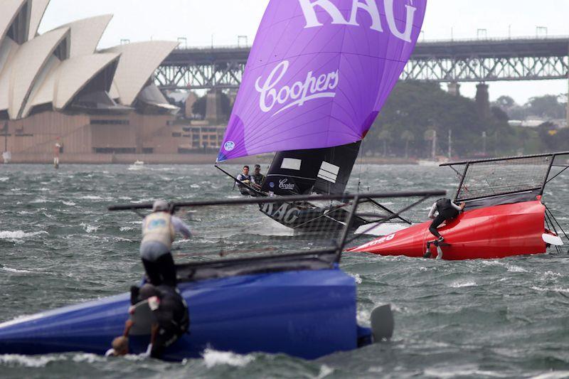 Lead is about to change as Rag and Famish Hotel goes past the capsized Yandoo and Smeg - 18ft Skiff NSW Championship race 5 - photo © Frank Quealey