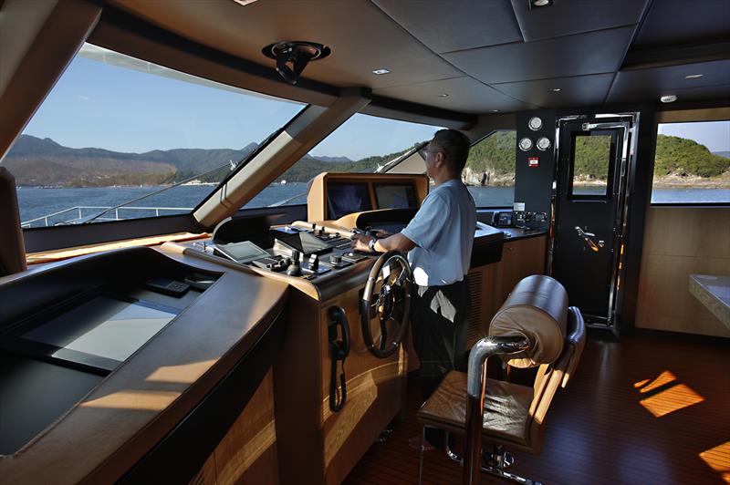 On the bridge photo copyright Guy Nowell taken at Royal Hong Kong Yacht Club and featuring the Superyacht class
