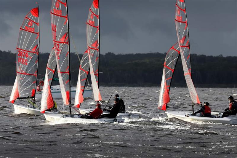 Competitors racing in between rain squalls on Race Day 1 at the NSW Tasar States 2022 photo copyright Sail Port Stephens / @sailorgirlHQ taken at Corlette Point Sailing Club and featuring the Tasar class