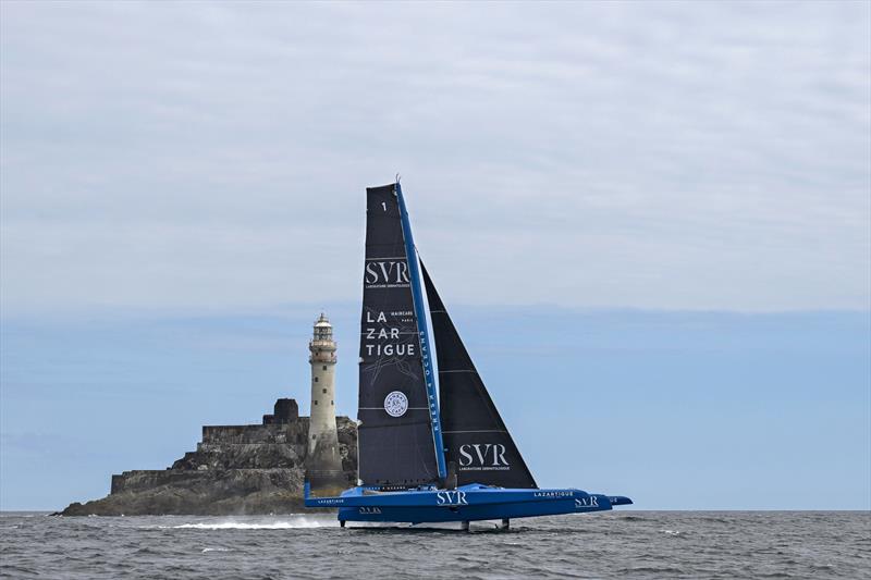 The Ultim trimaran SVR Lazartigue was the first yacht to round the Fastnet Rock in the Rolex Fastnet Race 2025 - photo © Rolex / Kurt Arrigo