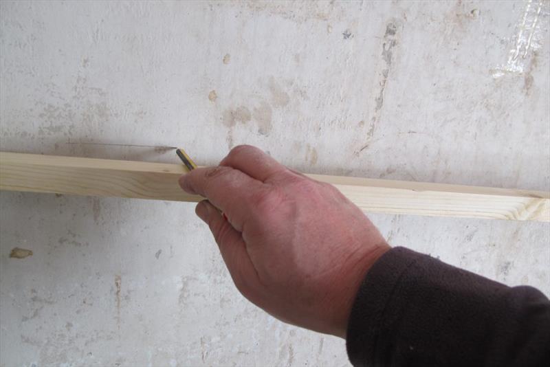 We ran a pencil line each side of the batten as a guide to prepping the hull later. - photo © Wessex Resins & Adhesives
