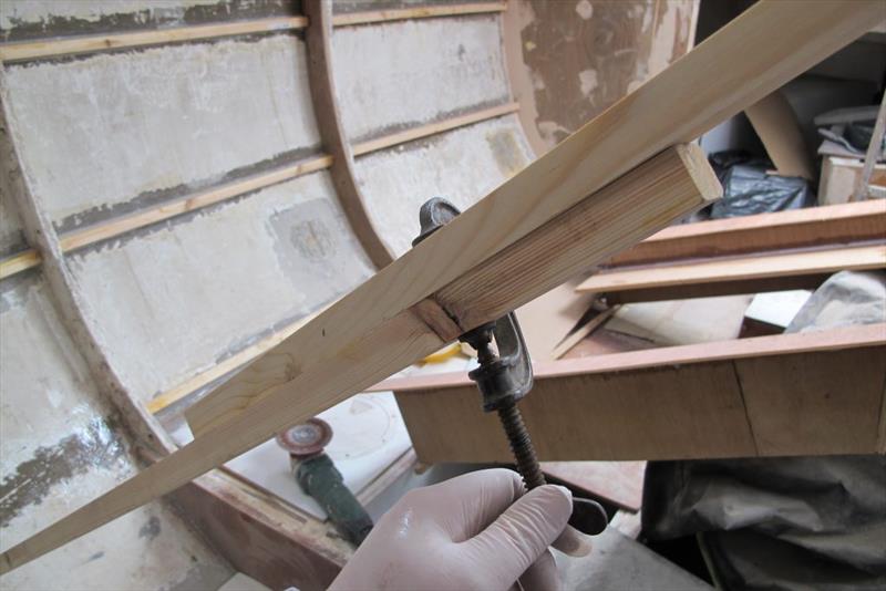 Props comprised of two sections of wood held in the centre by a couple of G-clamps were offered up for the correct length. - photo © Wessex Resins & Adhesives